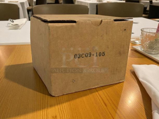 Cardboard box with black printing "03C09-105" containing a new Taprite CO2 Nitrogen Secondary Regulator.