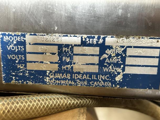Metal tag on Lumar Ideal LU-2X25S vacuum tumbler. Shows model, 115 volts, 60 Hz, 5 amps. Worn condition, made in Canada.