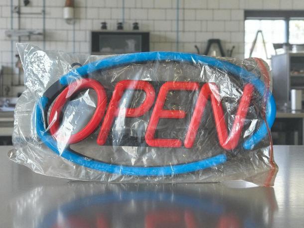 Brand new Utilitech 11.61-in LED open sign in packaging. Red "OPEN" text with a blue border. Ideal for storefronts.