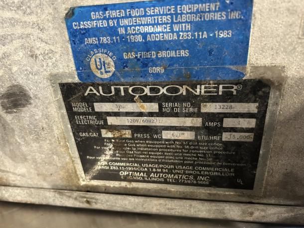 Optimal Automatics 3PG Autodoner vertical broiler, excellent condition. Label shows model 3PG, serial 13228, 120V/60Hz, 15,000 BTU.