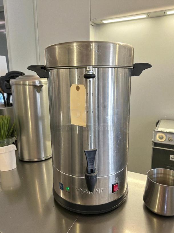 Waring WCU110 110 Cup Coffee Urn Brewer with dual heater, stainless steel, tested and working, features on/off switch.