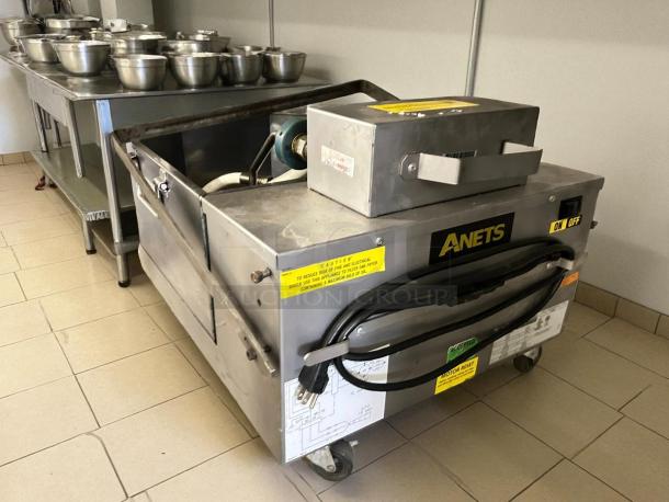 Anets FFM80 fryer filter in excellent condition; 80 lb capacity, gravity-fed, 120v, tested and working, with visible labels.