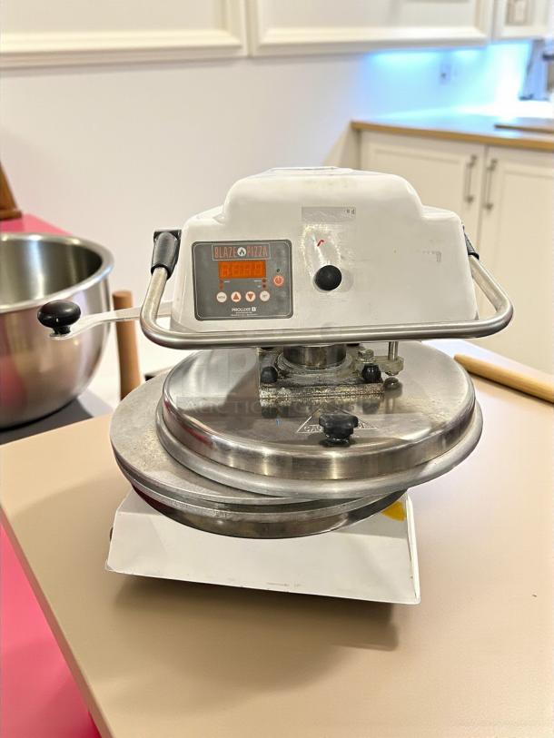 Proluxe Endurance 18" manual pizza dough press, heavy-duty, 120V, 1500W, tested and working. Control panel and knobs visible.