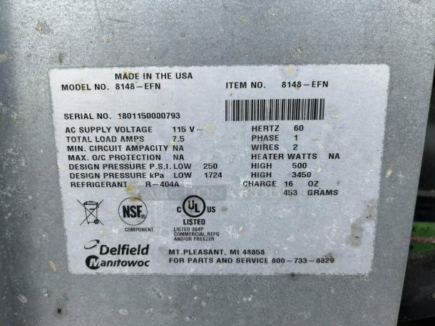 Label showing specs of Delfield 8148-EFNP refrigerator, 115V, serial number 1801150000793, made in USA, using R-404A refrigerant.