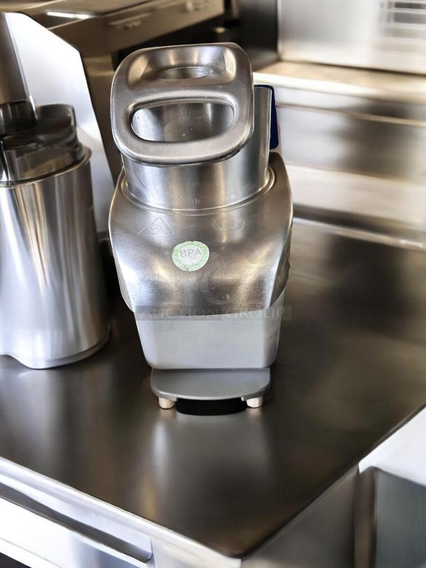 Electrolux TRS24NU continuous feed food processor, outstanding condition, BPA-free sticker, stainless steel finish.