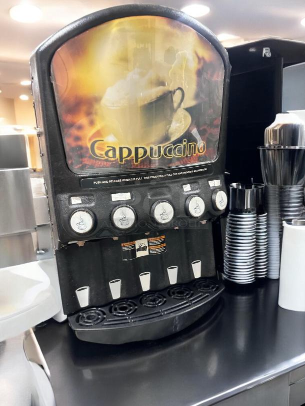 Grindmaster PIC5 five-flavor powdered cappuccino dispenser, great condition, fully tested, 120V, includes visible dispensing nozzles and control panel.