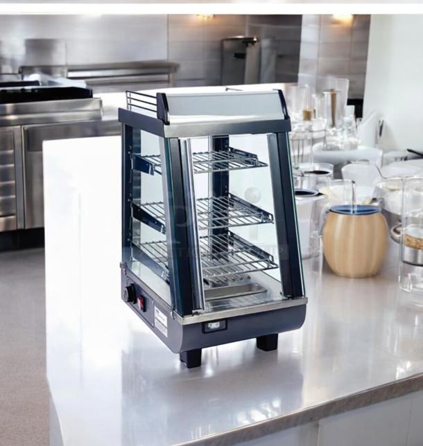 Winco HDM-13 commercial heated display merchandiser, 120V, outstanding condition, stainless steel, three shelves, fully tested.