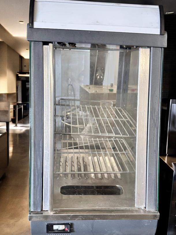 Winco HDM-13 commercial heated display merchandiser, outstanding condition, 120V, glass panels, two shelves, fully tested.