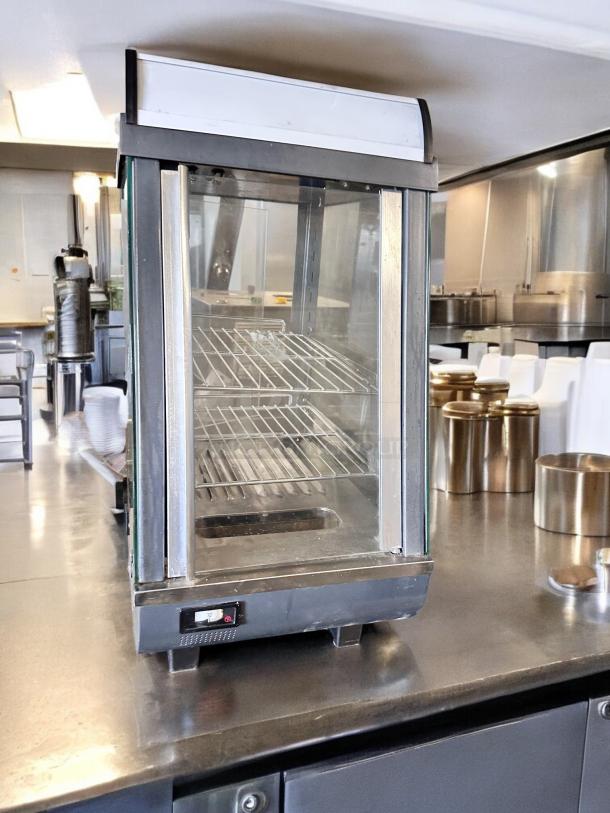 Winco HDM-13 commercial heated display merchandiser, excellent condition, 120V, stainless steel shelves, fully tested.