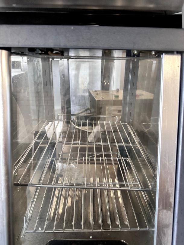 Winco HDM-13 heated display merchandiser in outstanding condition, 120V, stainless steel with glass door, fully tested.