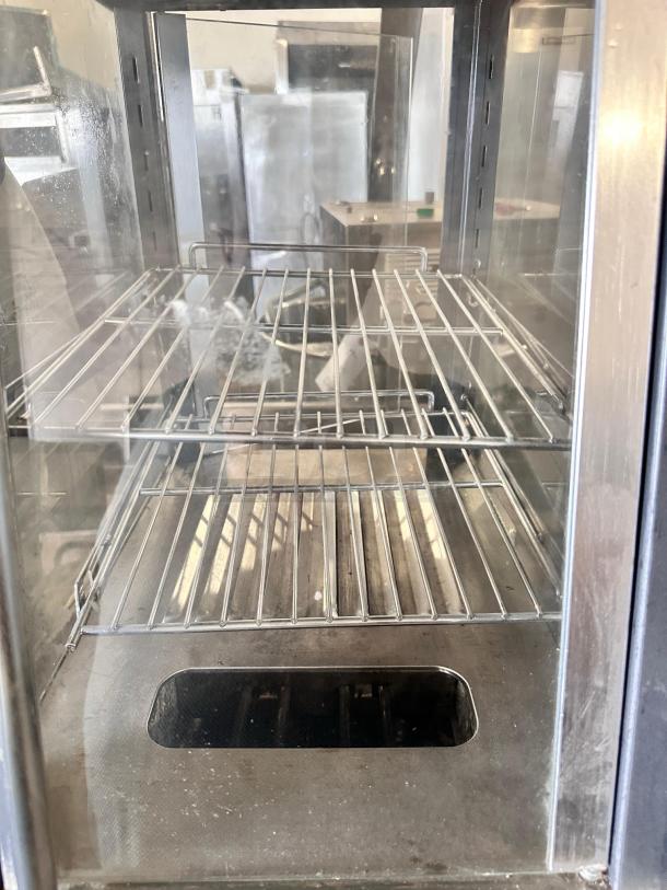 Winco HDM-13 commercial heated display merchandiser, stainless steel, two shelves, excellent condition, 120V, fully tested.