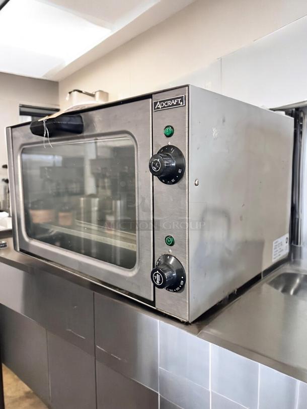 Adcraft COQ-1750W Countertop Convection Oven, superb condition, stainless steel, visible control knobs, 120V, USA-made.