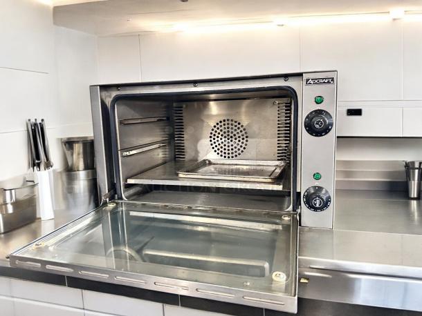 Adcraft COQ-1750W countertop convection oven in superb condition, stainless steel finish, open door, fully operational.