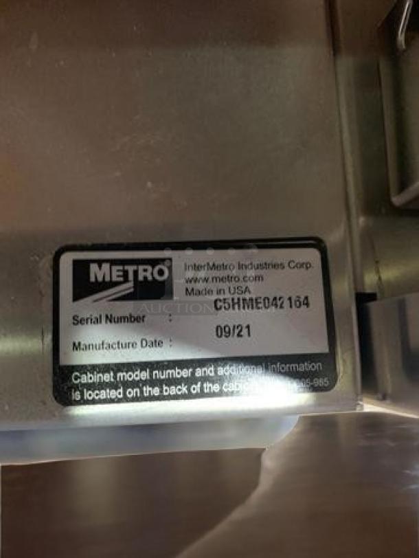 Metro C5HMEO4 heated holding cabinet, like-new condition, 120V, full height. Serial and manufacture date visible on label.