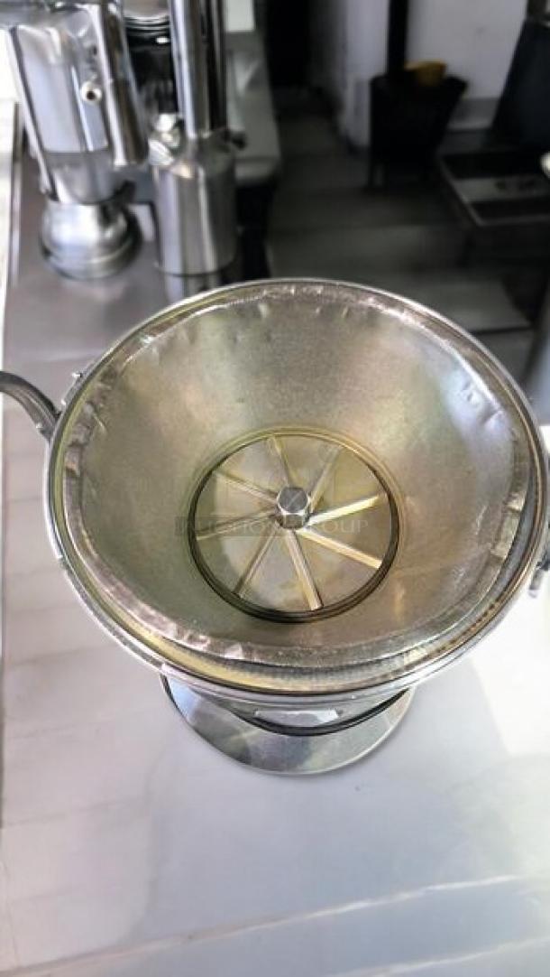 Ruby 2000 commercial juice extractor, stainless steel, heavy-duty, 115V, excellent condition, fully tested, by Ruby Manufacturing Co.