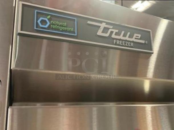 True T-35F-HC commercial freezer in immaculate condition. Shiny stainless steel, natural refrigerant label visible.