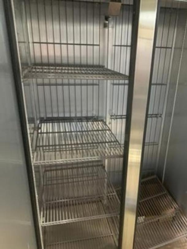 True T-35F-HC double door reach-in freezer in immaculate condition, showcasing interior shelving, fully tested and working.