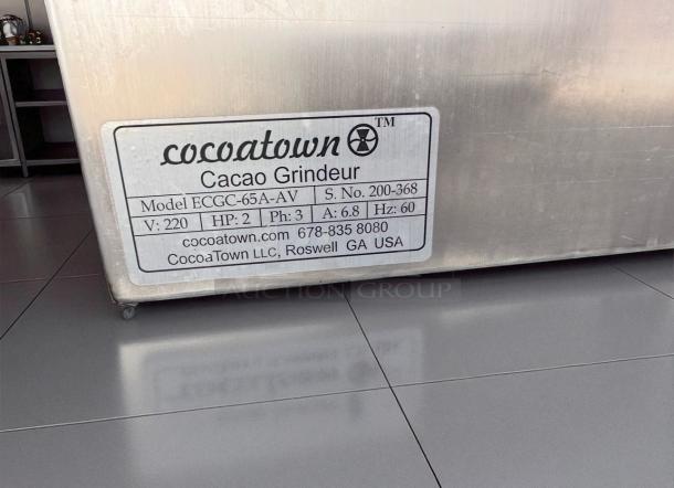 CocoaTown ECGC-65A-AV cacao grinder label showing model, voltage, and company info. Outstanding condition, fully operational.