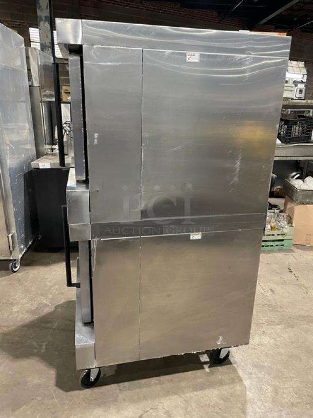 Bakers Pride Cyclone Series double stacked stainless steel electric convection oven with thermostatic control, wired rack, on casters.