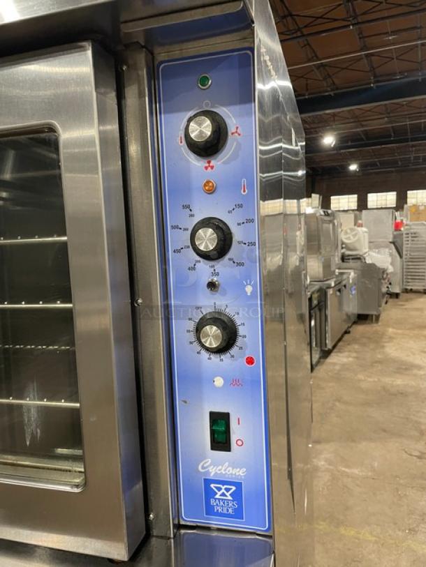 Bakers Pride Cyclone Series stainless steel double convection oven, thermostatic control, wired rack, on casters.
