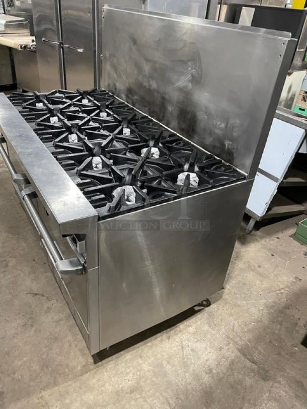 U.S. Range stainless steel 10 burner range with double oven, natural gas-powered, includes backsplash and wired oven rack.