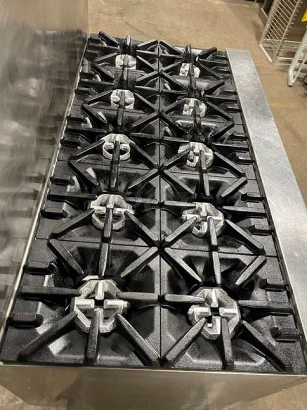 U.S. Range commercial stainless steel 10 burner range with double oven, backsplash, and wired oven rack; natural gas-powered.