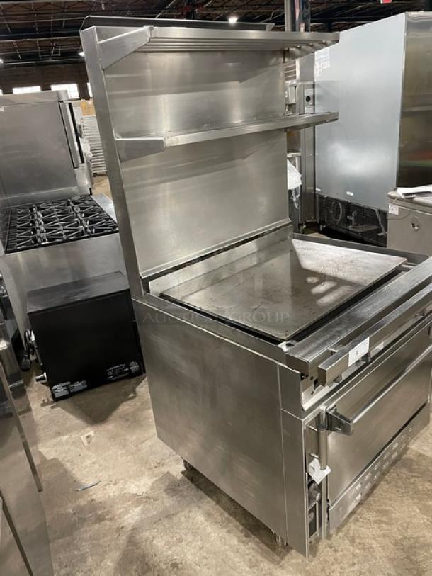 Jade Range 36" stainless steel flat top range/oven combo, natural gas, with backsplash, double overhead shelf, and casters.