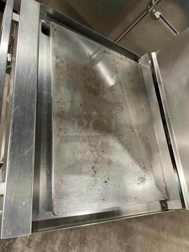 Jade Range 36" stainless steel flat top commercial range with backsplash, double overhead shelf, and wired oven rack.