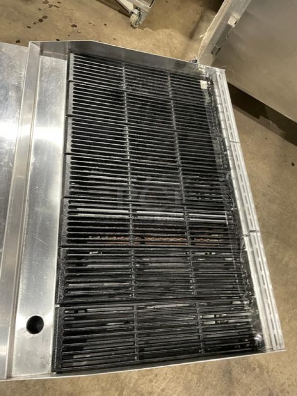 Therma-Tek stainless steel natural gas char broiler with back and side splash, on legs. Good condition, clean grates.