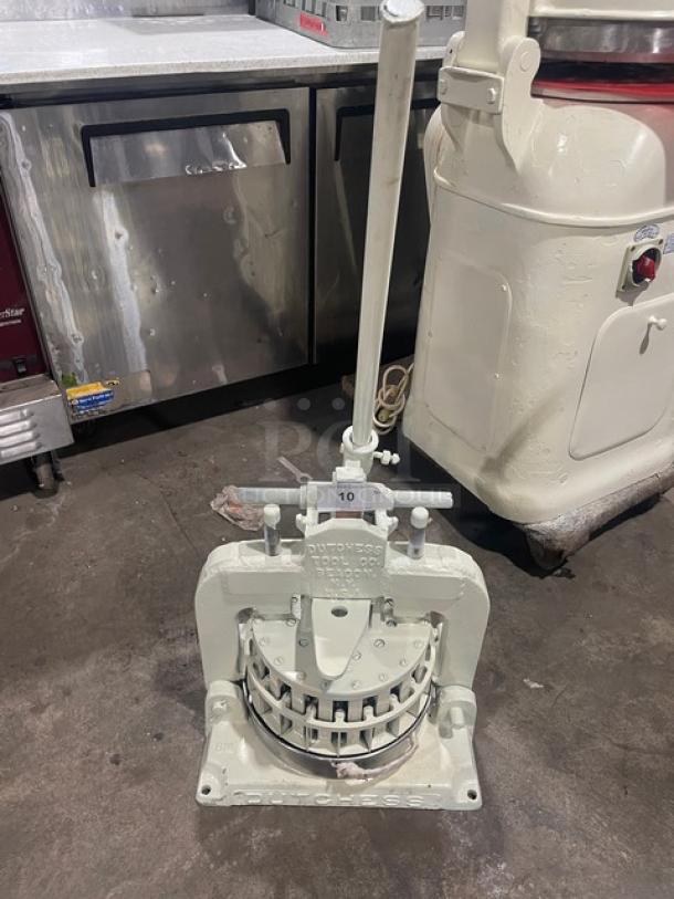 Dutchess Commercial Manual Dough Divider, Model BMIH, heavy-duty, metal construction, lever mechanism, fair used condition.