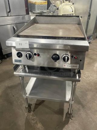 Garland stainless steel natural gas flat griddle with thermostatic control, back & side splash, on legs. Includes BK Resource undershelf stand on casters.