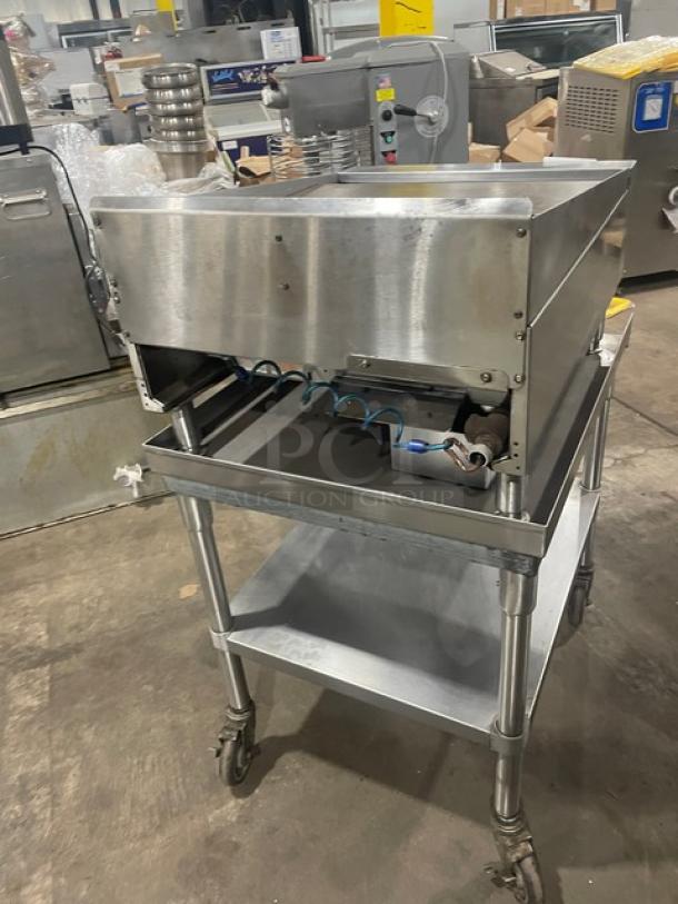 Garland stainless steel gas-powered flat griddle with thermostatic control, back and side splash on casters, includes BK Resource undershelf stand.