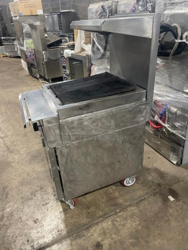 Vulcan VCBB24B stainless steel char broiler with storage base, overhead salamander shelf, and casters. Natural gas powered.