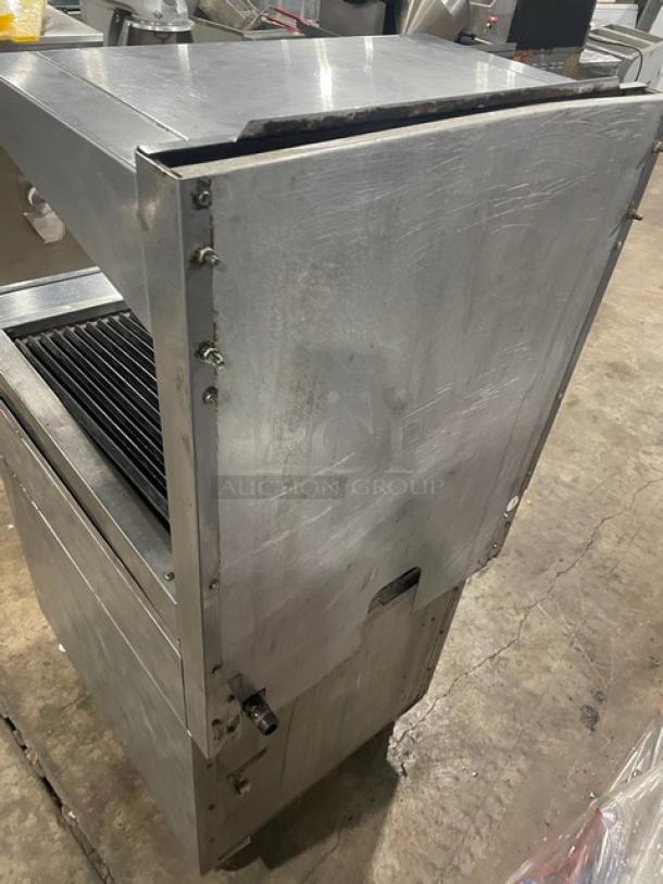 Vulcan VCBB24B stainless steel char broiler range with overhead salamander, cabinet storage, and backsplash. On casters.