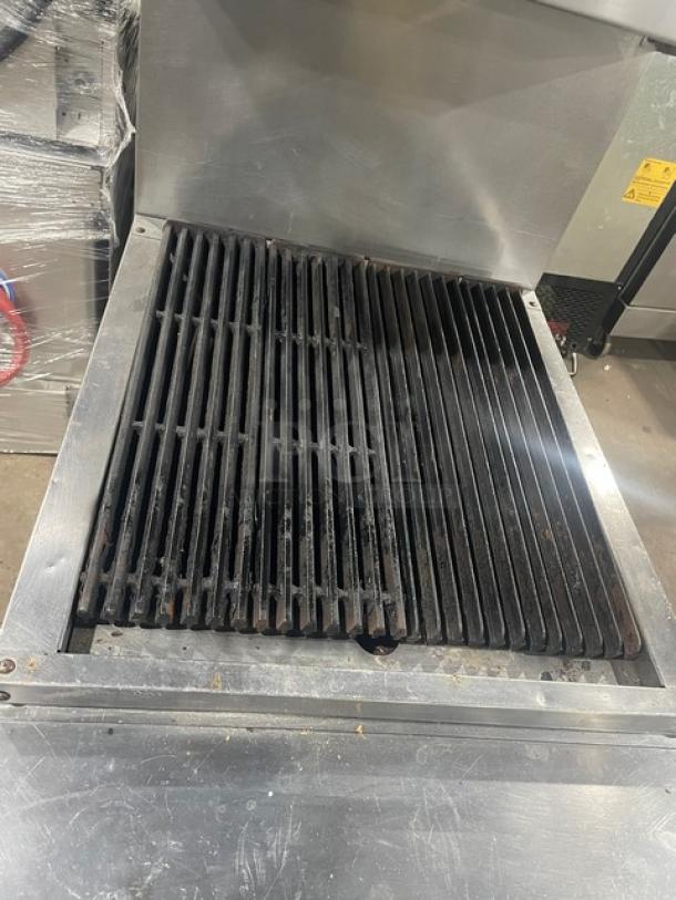 Vulcan VCBB24B 24" stainless steel char broiler range with cabinet base, backsplash, and salamander shelf. Natural gas, on casters.