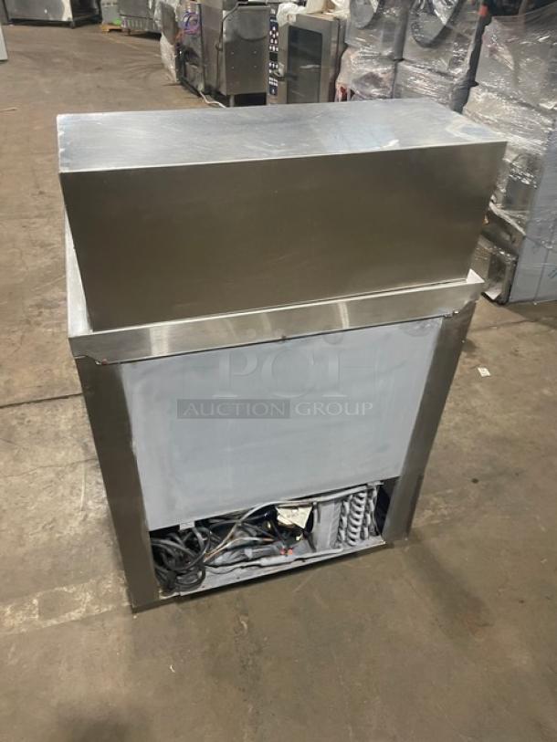 Leader Commercial Stainless Steel Single Door Refrigerated Prep Table, Model NSFM27, on casters, open back view.