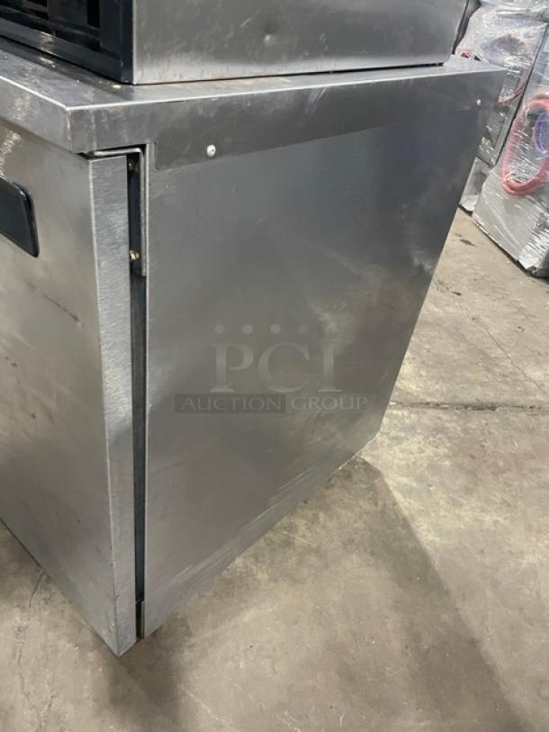 Delfield 406STAR2 stainless steel undercounter refrigerator, single door, poly-coated rack, 115V, on casters, used condition.