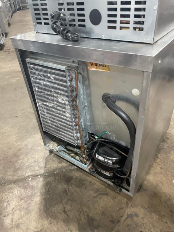 Delfield Enodis Series 406STAR2 stainless steel undercounter refrigerator with poly coated rack, model 406-STAR2, on casters.
