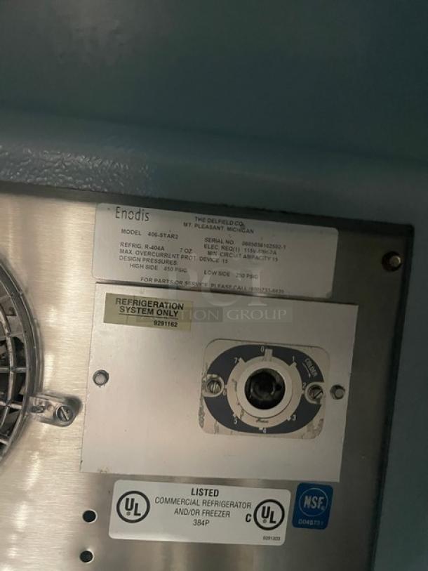 Delfield Enodis Series 406STAR2 stainless steel refrigerator label, showing model, SN, UL certification, and specs.