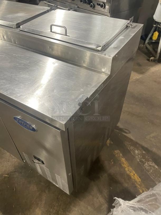 Entree stainless steel 2-door refrigerated pizza prep table, Model P70, features poly coated wired rack, on casters, 115V.