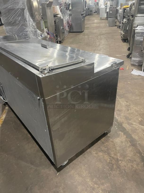 Entree P70 stainless steel 2-door pizza prep table, refrigerated Bain Marie style, includes poly-coated wire rack, on casters.