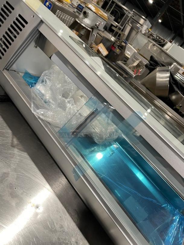 NEW Marchia 46" curved glass sushi merchandiser, model MSU140S, with LED lights, double sliding doors, and 4-pan setup.