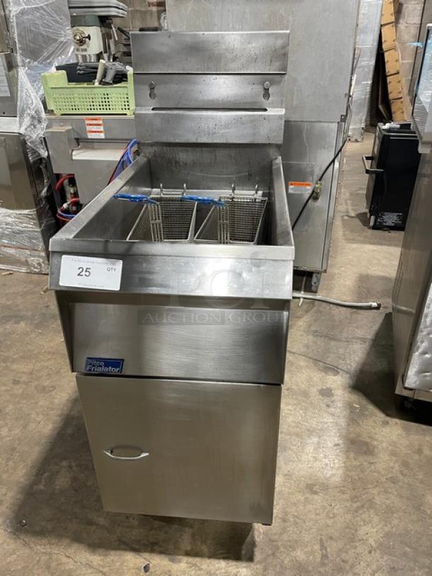 Pitco Frialator commercial stainless steel deep fat fryer with backsplash, basket hanger, and fry basket. Natural gas powered. On legs.