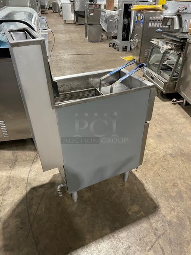 Pitco Frialator Series commercial stainless steel deep fat fryer with natural gas power, back splash, basket hanger, and legs.