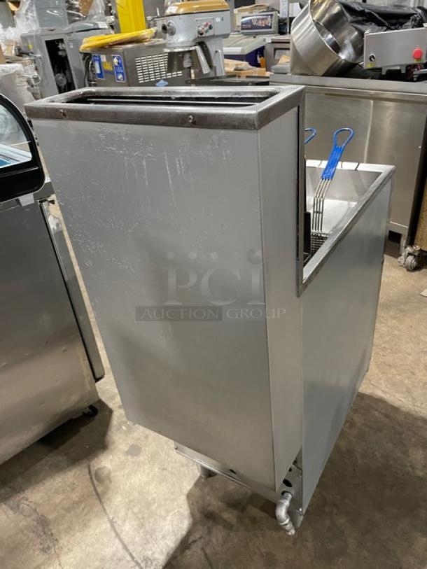Pitco Frialator deep fat fryer, stainless steel, natural gas, with backsplash, basket hanger, fry basket, and legs.