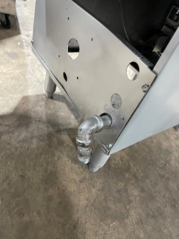 Pitco Frialator Series stainless steel deep fat fryer, natural gas powered, with backsplash, basket hanger, fry basket, on legs.