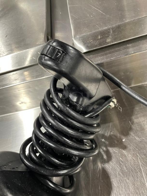 Waring Big Stik commercial immersion blender with black grip handle, stainless steel shaft, and coiled cord.