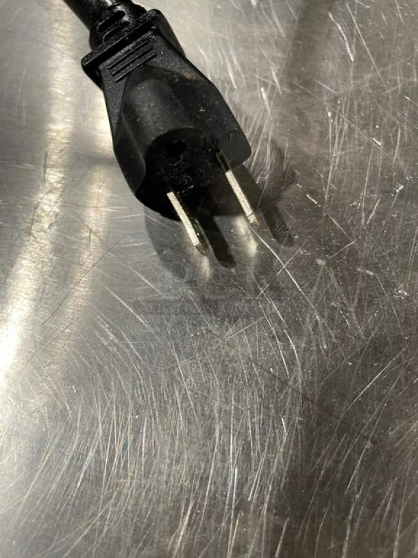 Waring Big Stik Series immersion blender with stainless steel shaft, black grip handle, electric plug, scratches visible on plug.