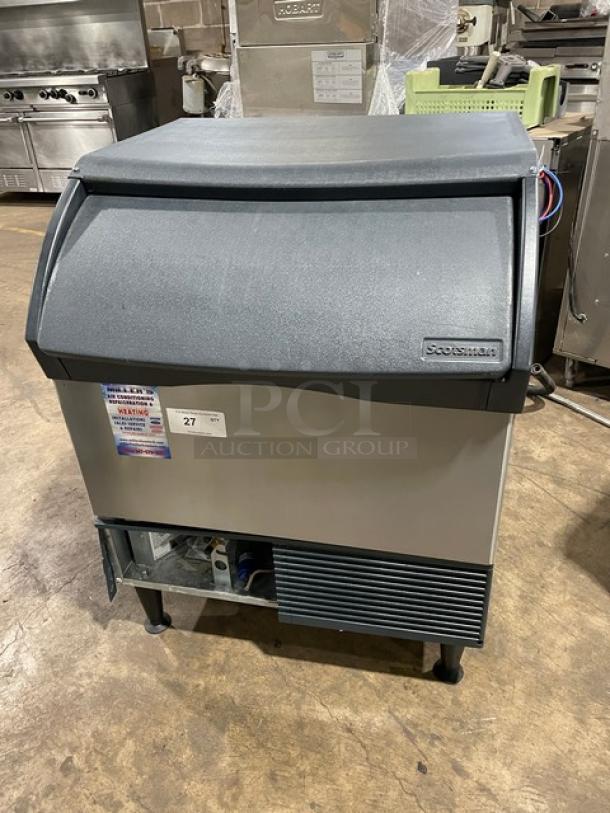 Scotsman Prodigy Series undercounter ice maker CU3030SW-1E, stainless steel, water-cooled, on legs, model details visible.