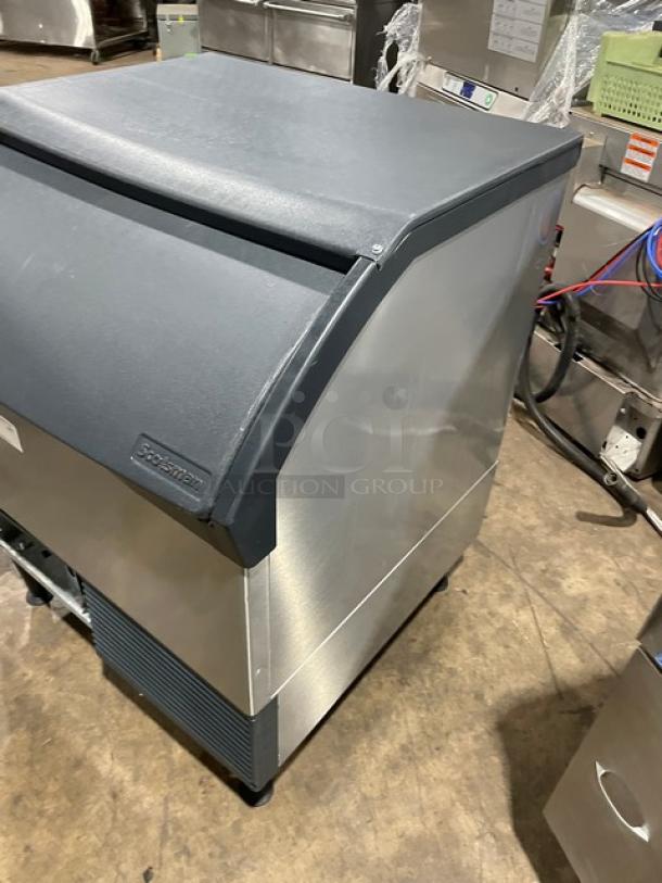 Scotsman Prodigy Series stainless steel ice-making machine, model CU3030SW1E, with bin, water-cooled, on legs, good condition.